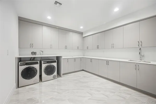 a bathroom with a toilet sink and shower