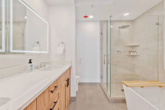 a bathroom with a bathtub and a shower