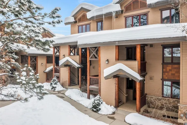 a large kitchen with stainless steel appliances kitchen island granite countertop a large counter top and stainless steel appliances