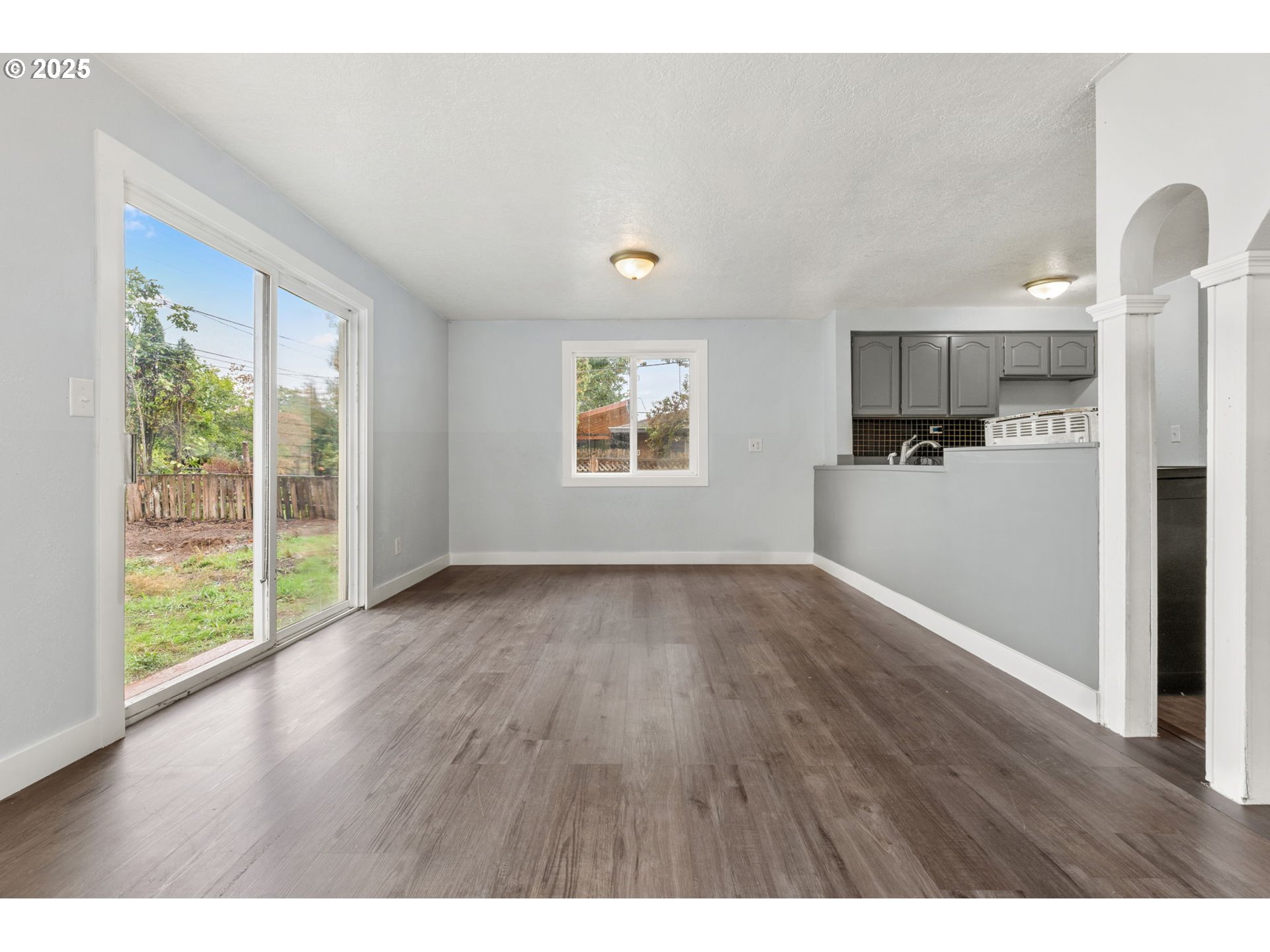 1203 Northeast 190th Place Portland, OR 97230 - Photo 12 of 48 a view of a kitchen with wooden floor electronic appliances and windows
