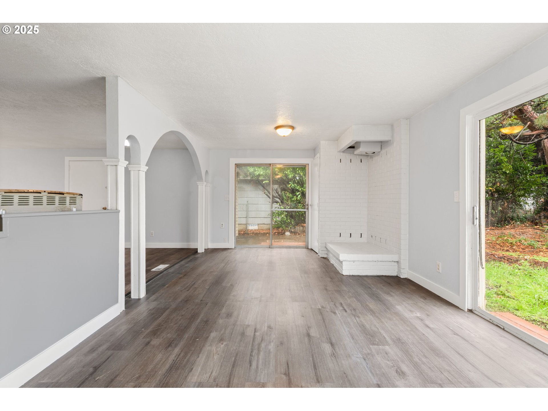1203 Northeast 190th Place Portland, OR 97230 - Photo 14 of 48 a view of empty room with wooden floor and fan