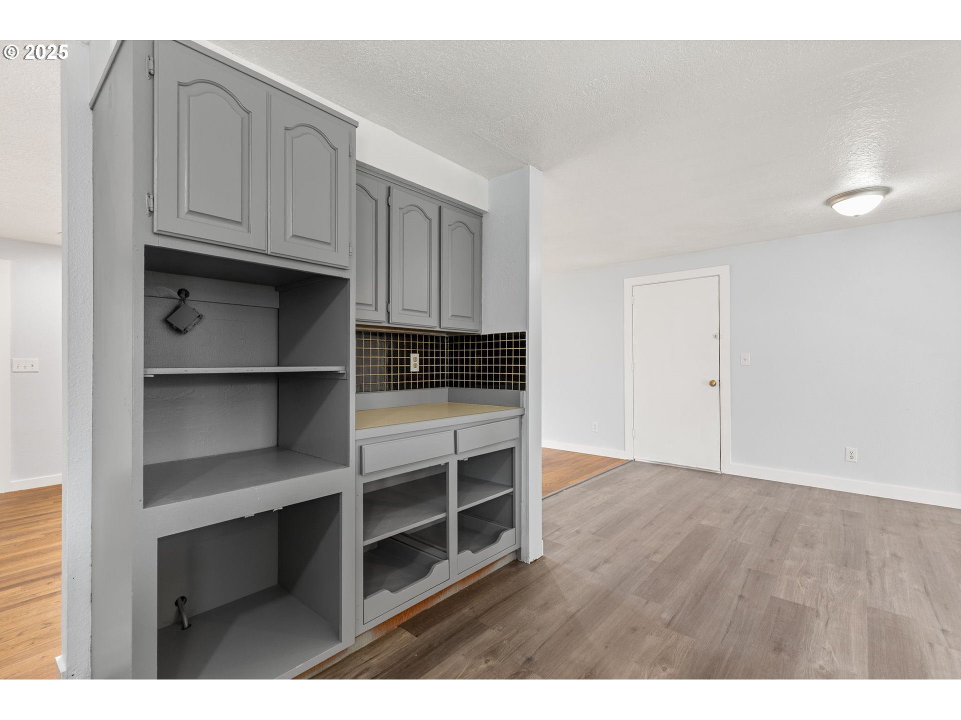 1203 Northeast 190th Place Portland, OR 97230 - Photo 22 of 48 a view of kitchen with wooden floor and cabinets