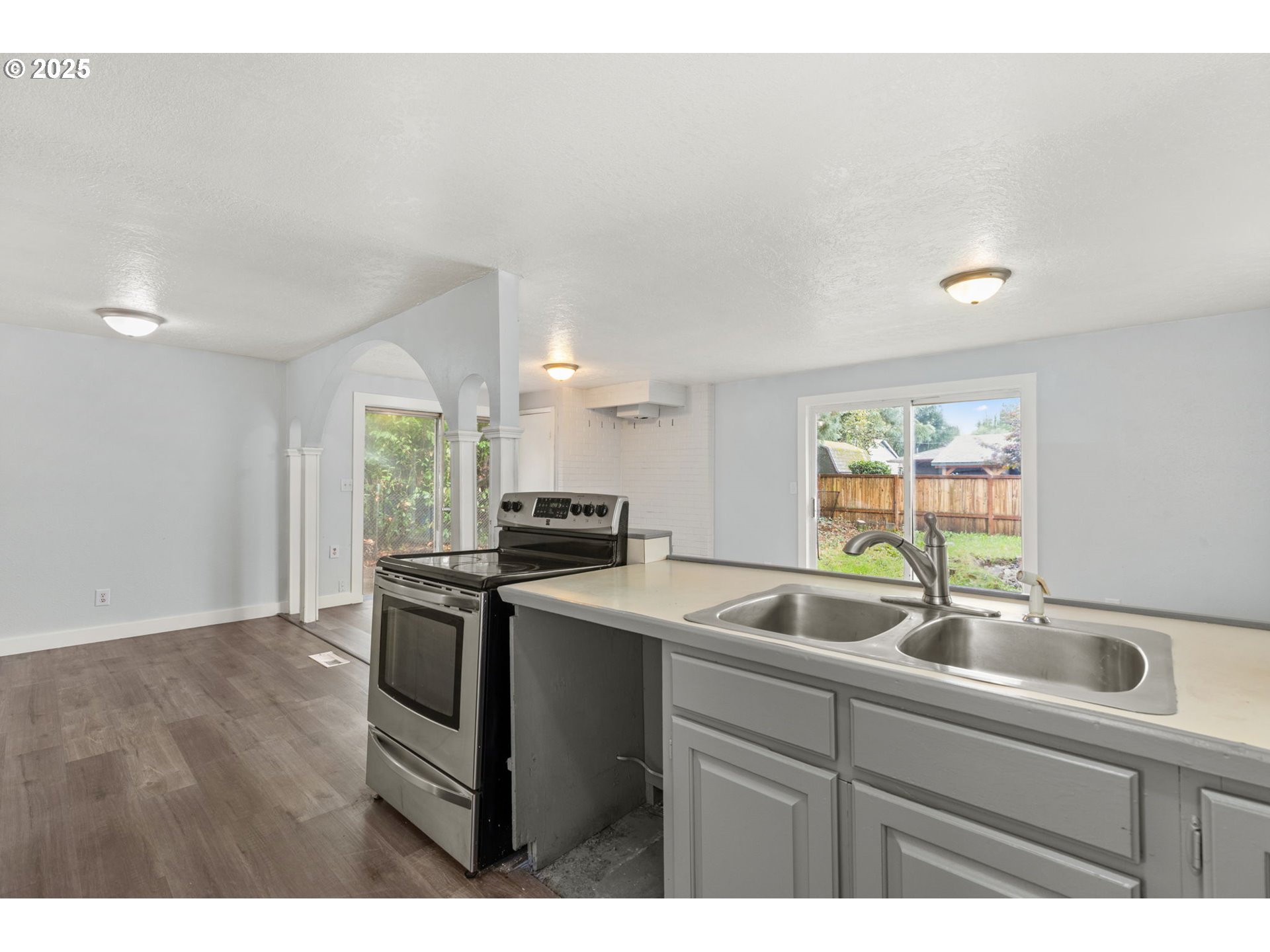 1203 Northeast 190th Place Portland, OR 97230 - Photo 23 of 48 a kitchen with a sink cabinets and window