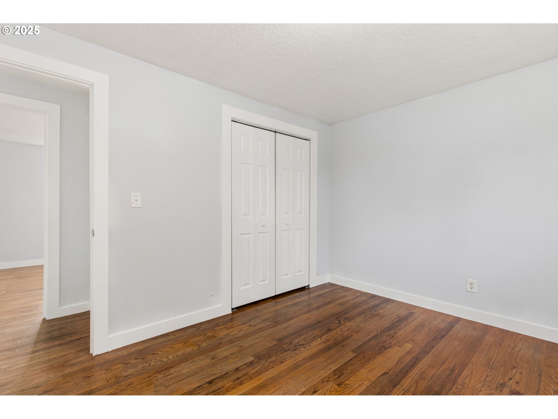 1203 Northeast 190th Place Portland, OR 97230 - Photo 25 of 48 a view of an empty room with wooden floor
