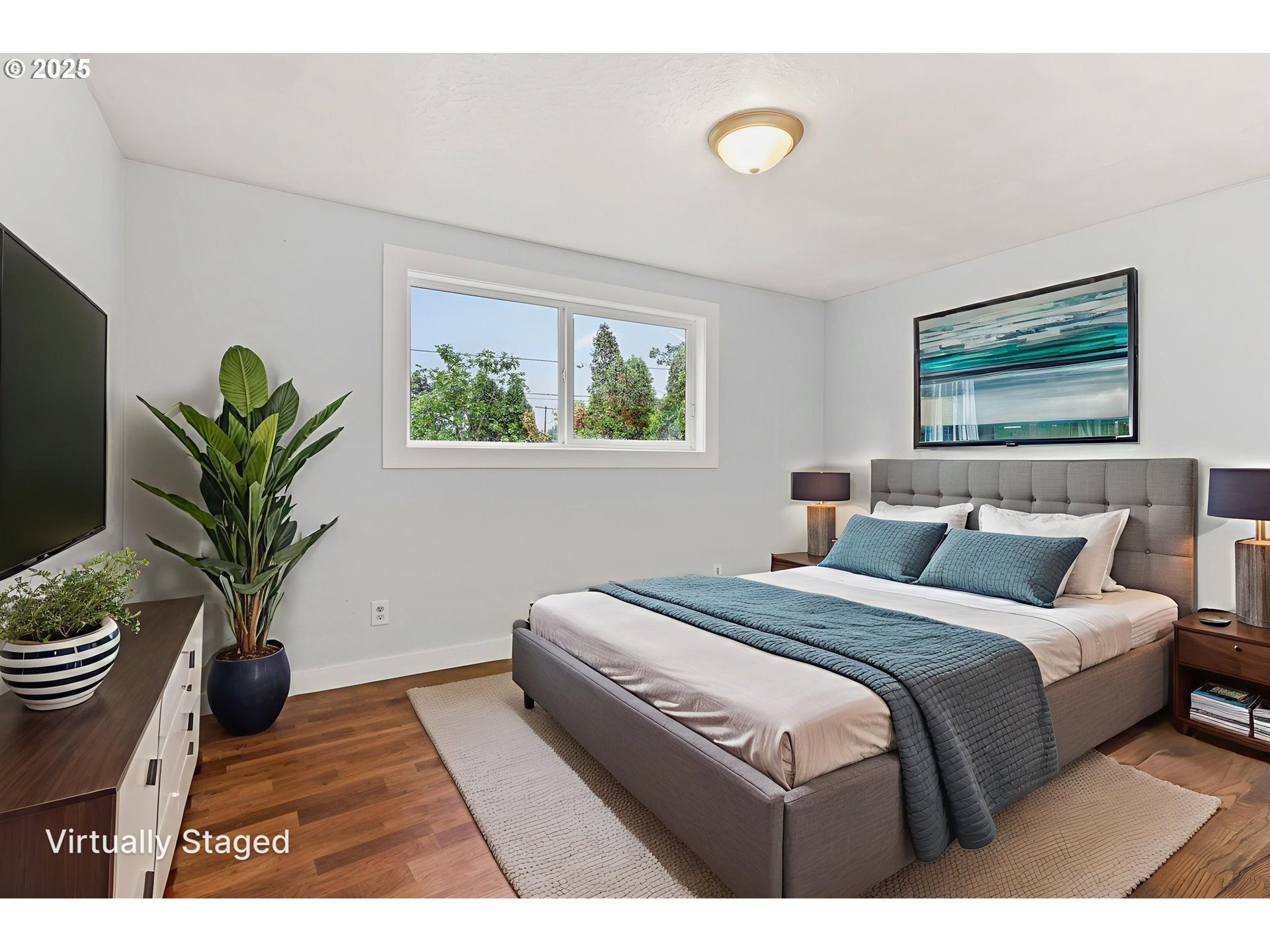 1203 Northeast 190th Place Portland, OR 97230 - Photo 26 of 48 a bedroom with bed and a potted plant