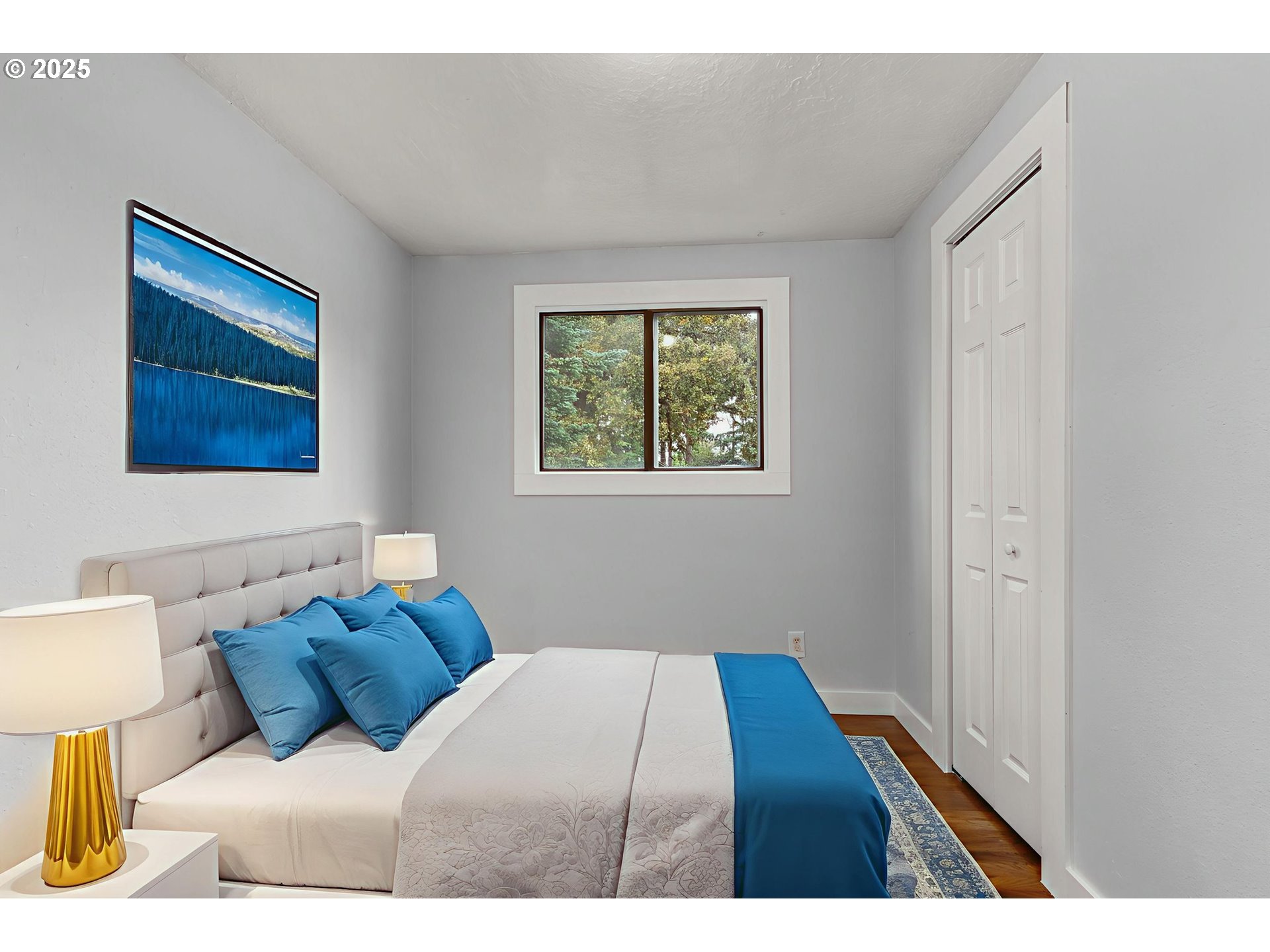 1203 Northeast 190th Place Portland, OR 97230 - Photo 31 of 48 a bedroom with a bed and a night stand