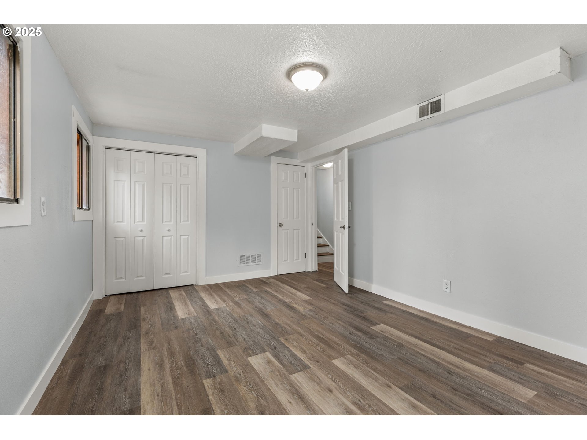 1203 Northeast 190th Place Portland, OR 97230 - Photo 40 of 48 a view of an empty room with wooden floor