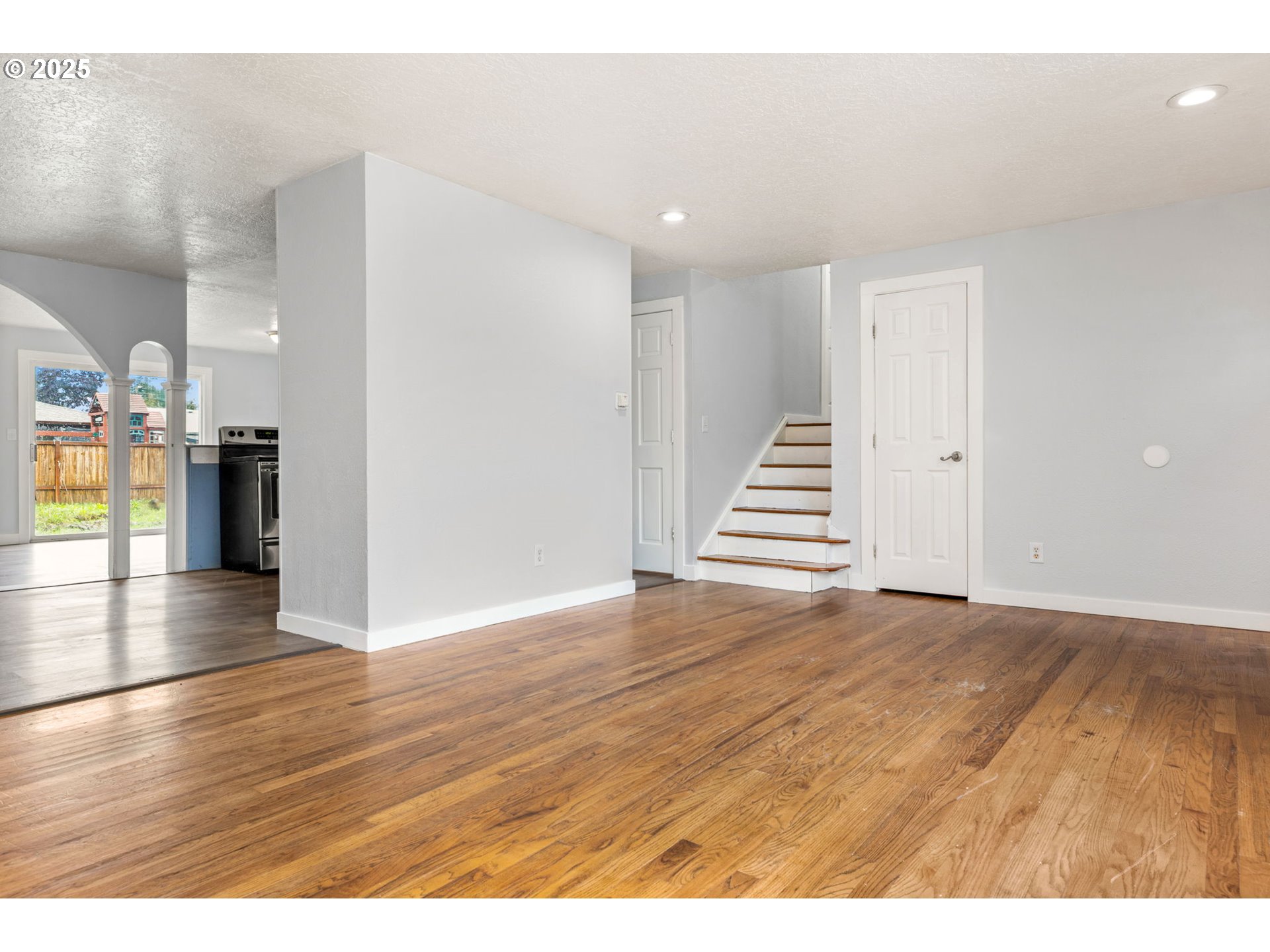 1203 Northeast 190th Place Portland, OR 97230 - Photo 9 of 48 a view of a kitchen with wooden floor and stairs