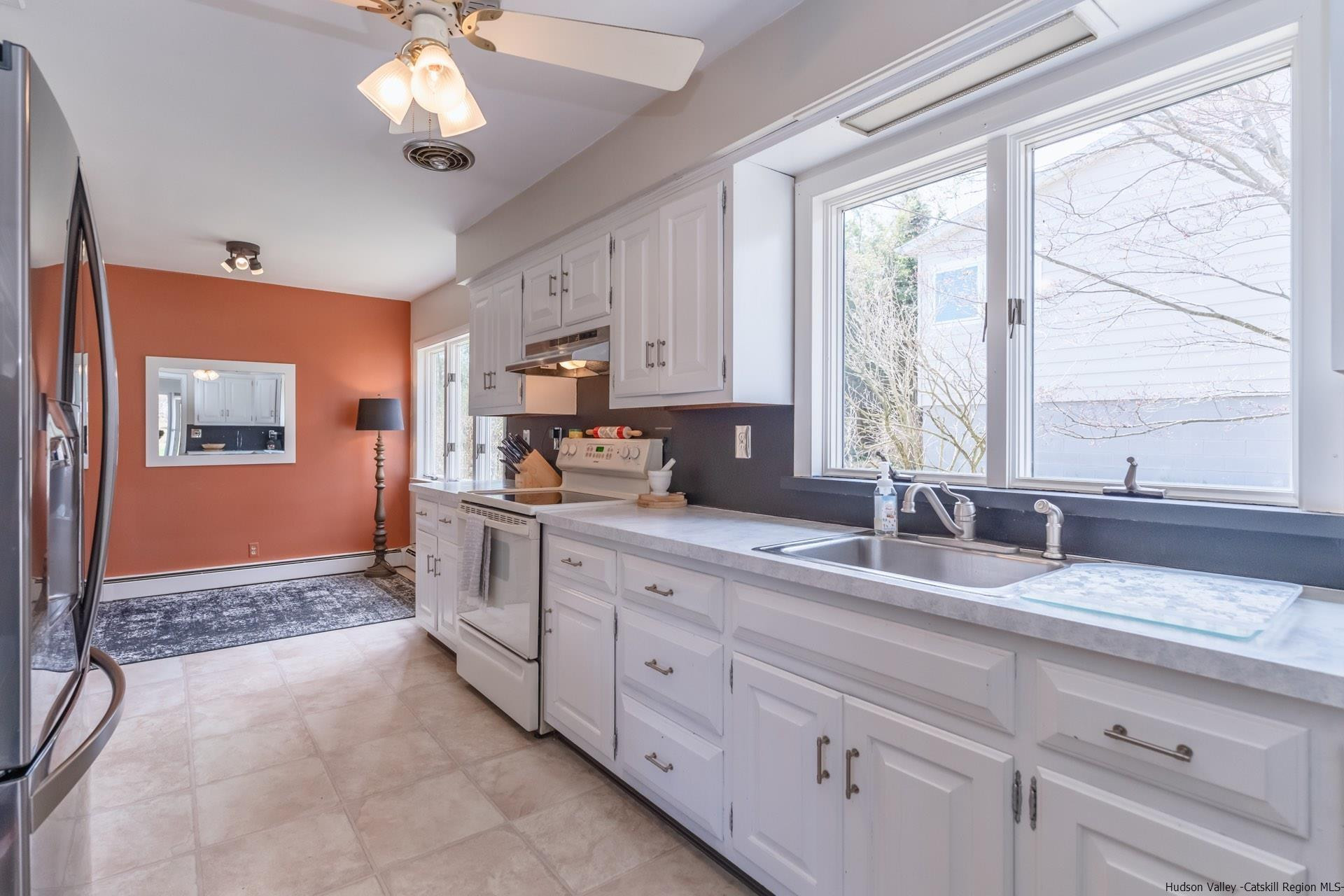 51 Sharon Lane Kingston, NY 12401 - Photo 11 of 29 a large kitchen with a large window appliances and cabinets