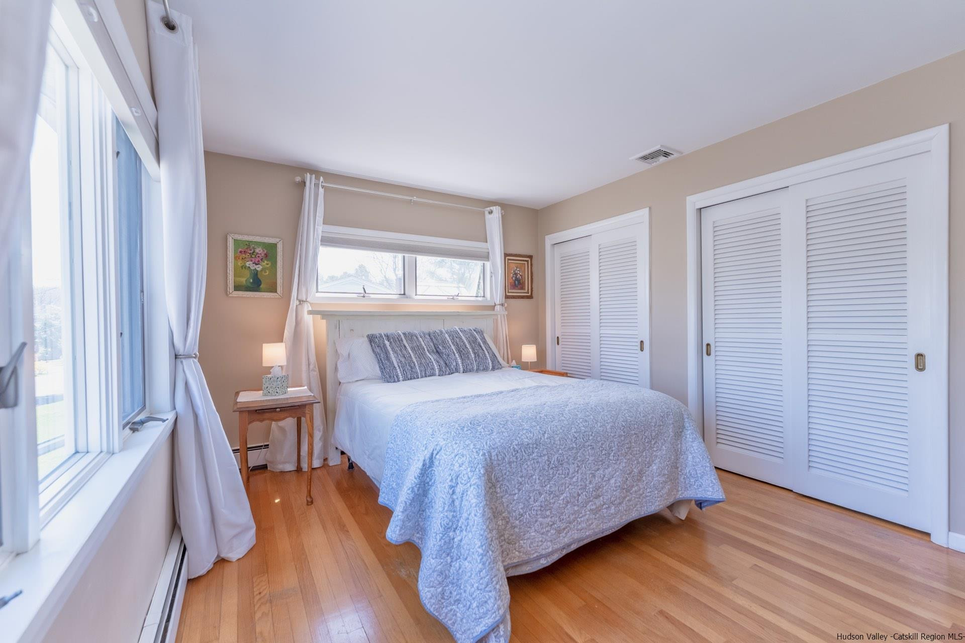 51 Sharon Lane Kingston, NY 12401 - Photo 18 of 29 a bedroom with a bed and a large window