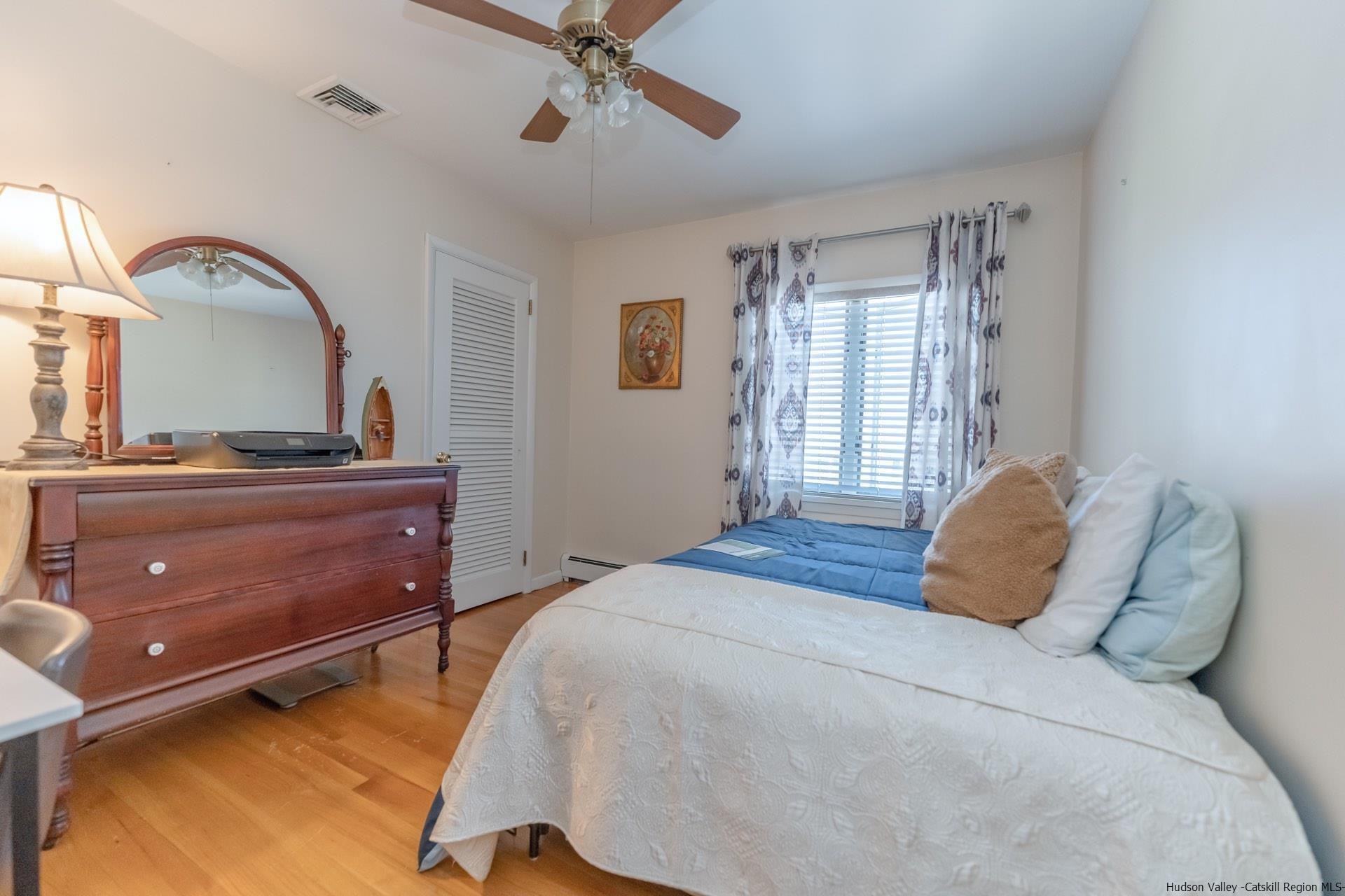 51 Sharon Lane Kingston, NY 12401 - Photo 20 of 29 a bedroom with a bed and a dresser