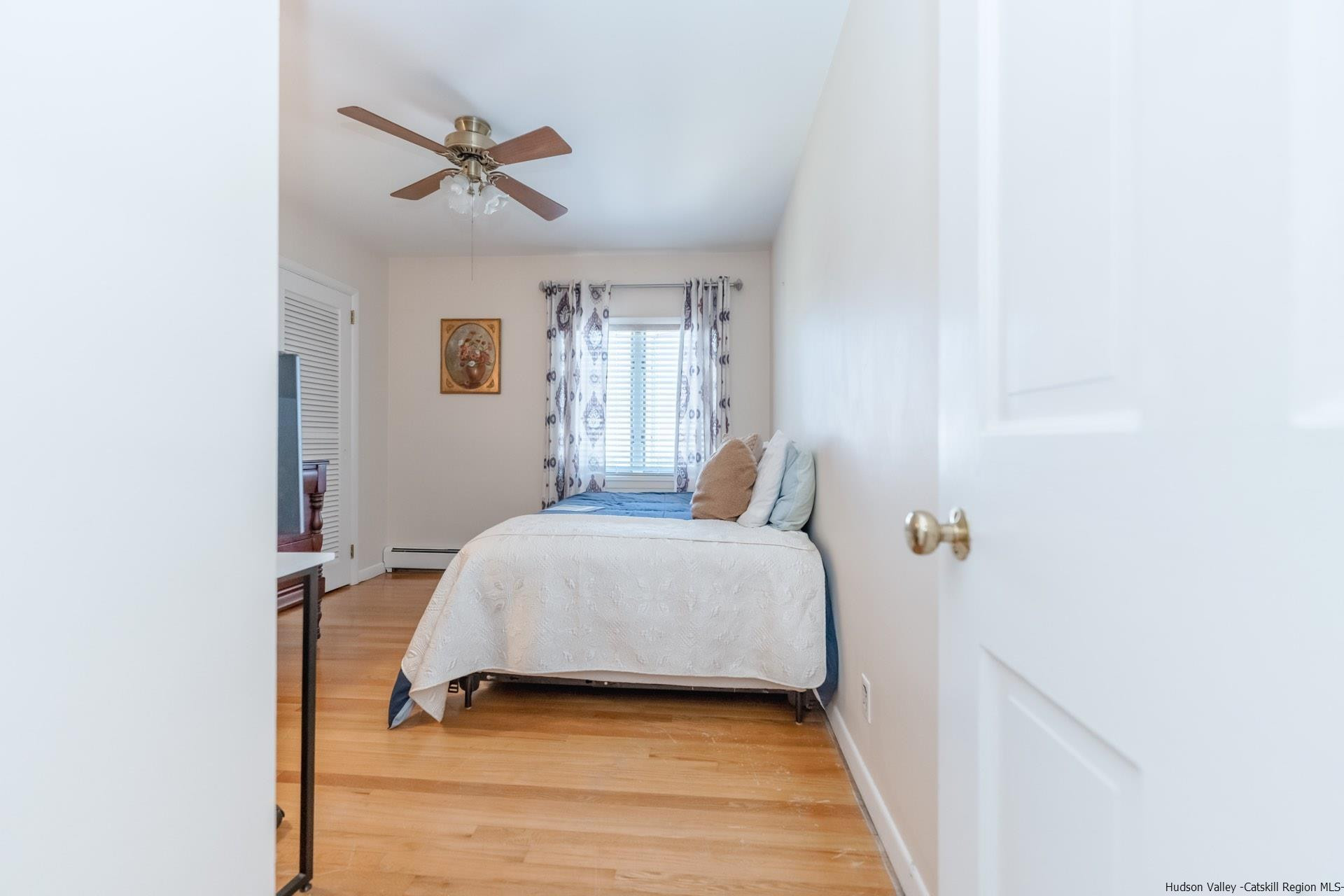 51 Sharon Lane Kingston, NY 12401 - Photo 21 of 29 a bedroom with a bed and a ceiling fan