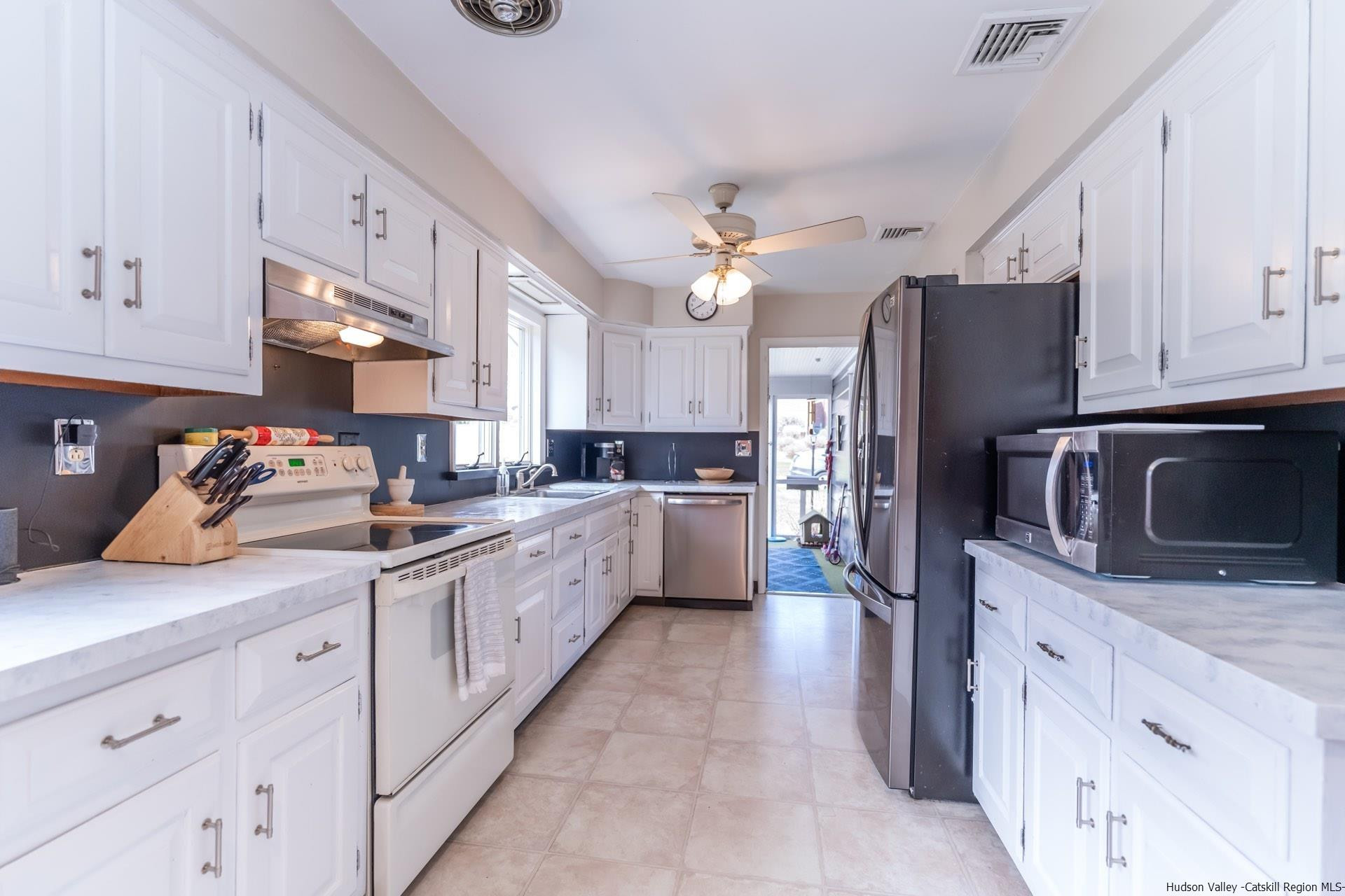 51 Sharon Lane Kingston, NY 12401 - Photo 9 of 29 a kitchen with granite countertop a sink stainless steel appliances and cabinets