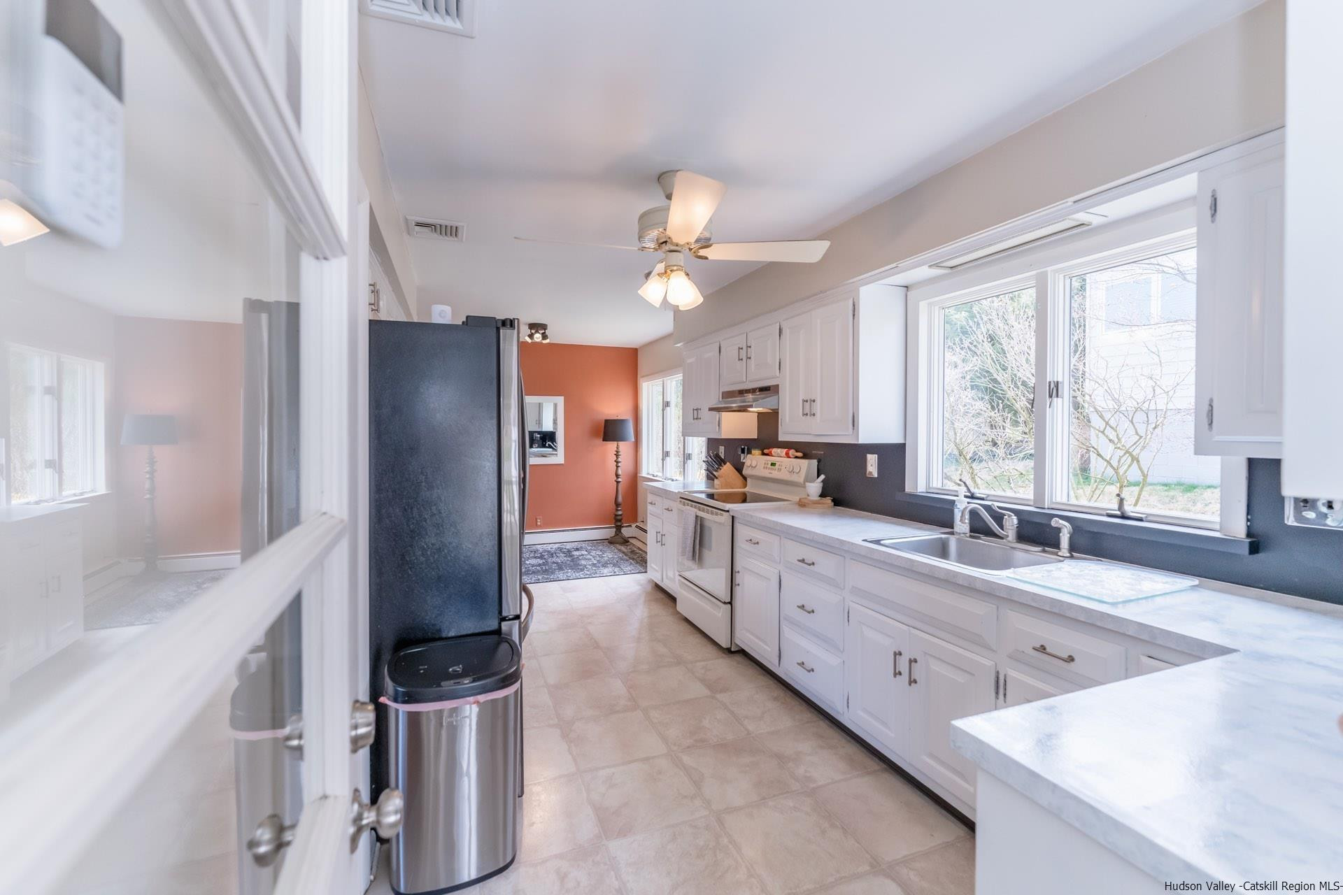 51 Sharon Lane Kingston, NY 12401 - Photo 10 of 29 a large kitchen with a large window appliances and cabinets