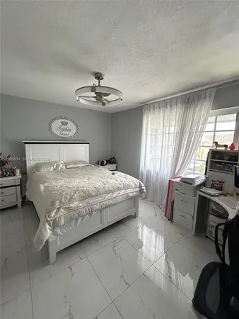 a bathroom with a shower a toilet and sink