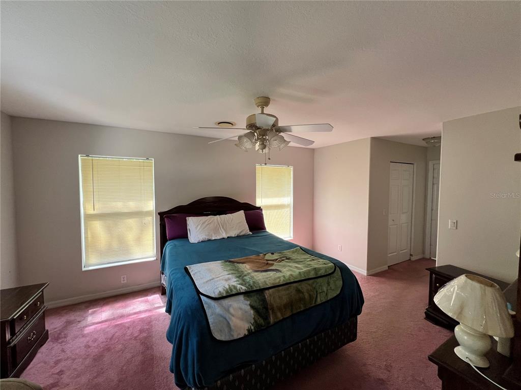 1995 East Newhaven Street Inverness, FL 34453 - Photo 28 of 48 a bedroom with a bed and a window