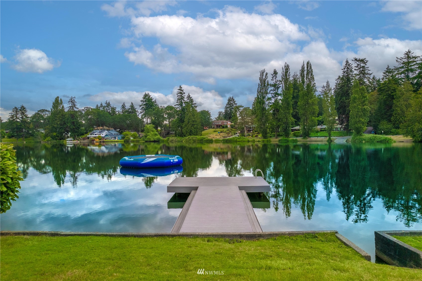 9215 Lake Steilacoom Point Road Southwest Lakewood, WA 98498 - Photo 1 of 36 a lake view with a garden