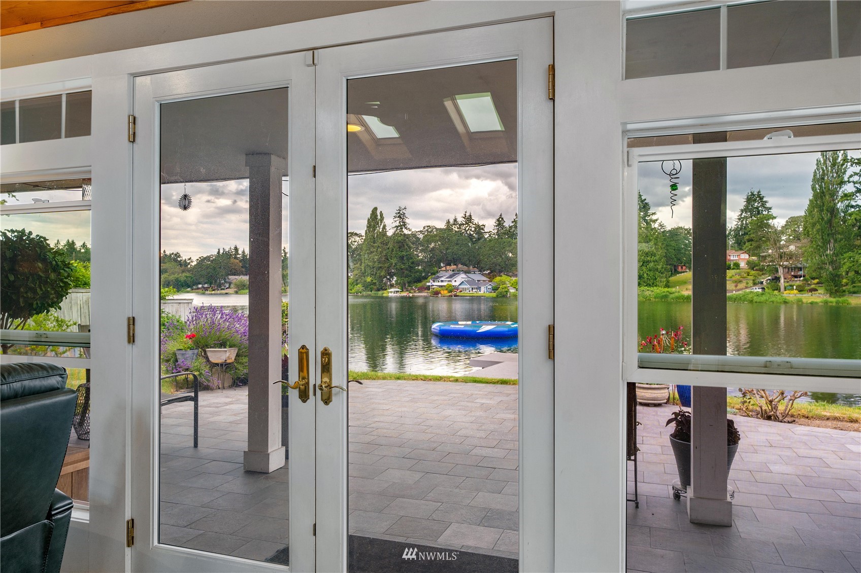 9215 Lake Steilacoom Point Road Southwest Lakewood, WA 98498 - Photo 16 of 36 a picture of a glass door with a view of living room