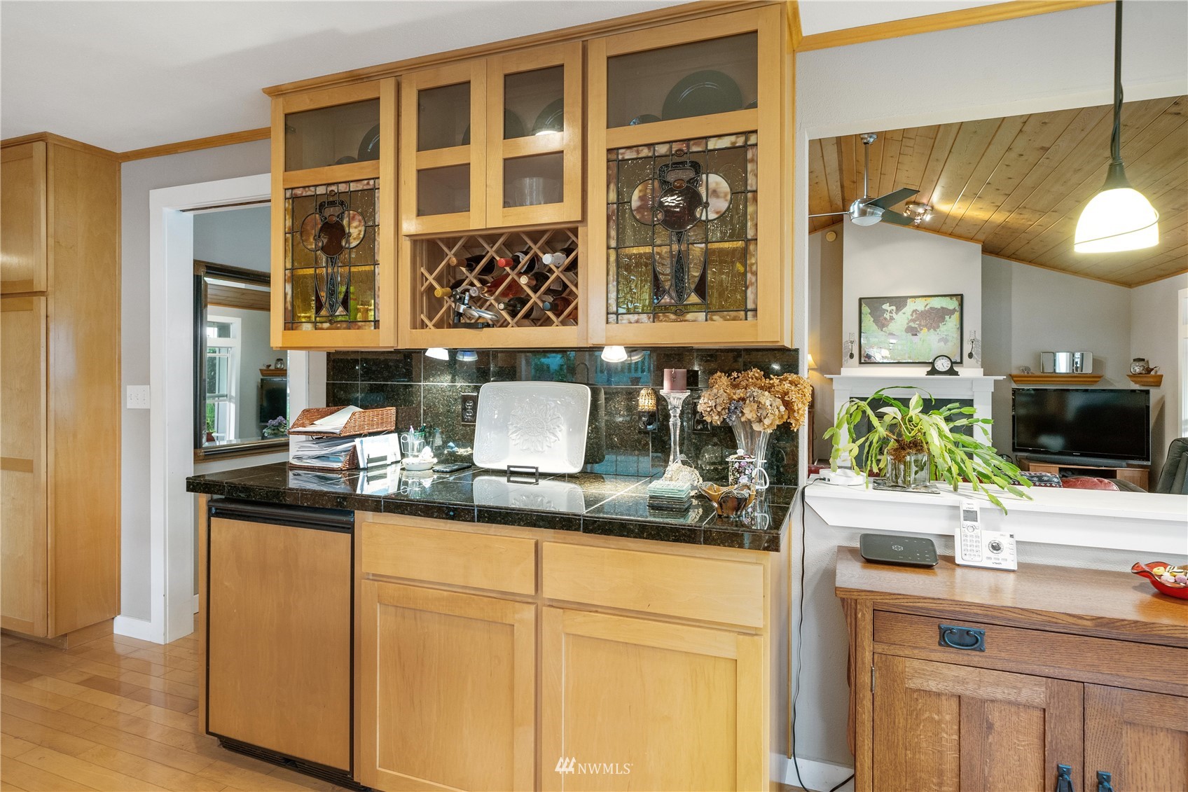 9215 Lake Steilacoom Point Road Southwest Lakewood, WA 98498 - Photo 20 of 36 a kitchen with a sink and cabinets