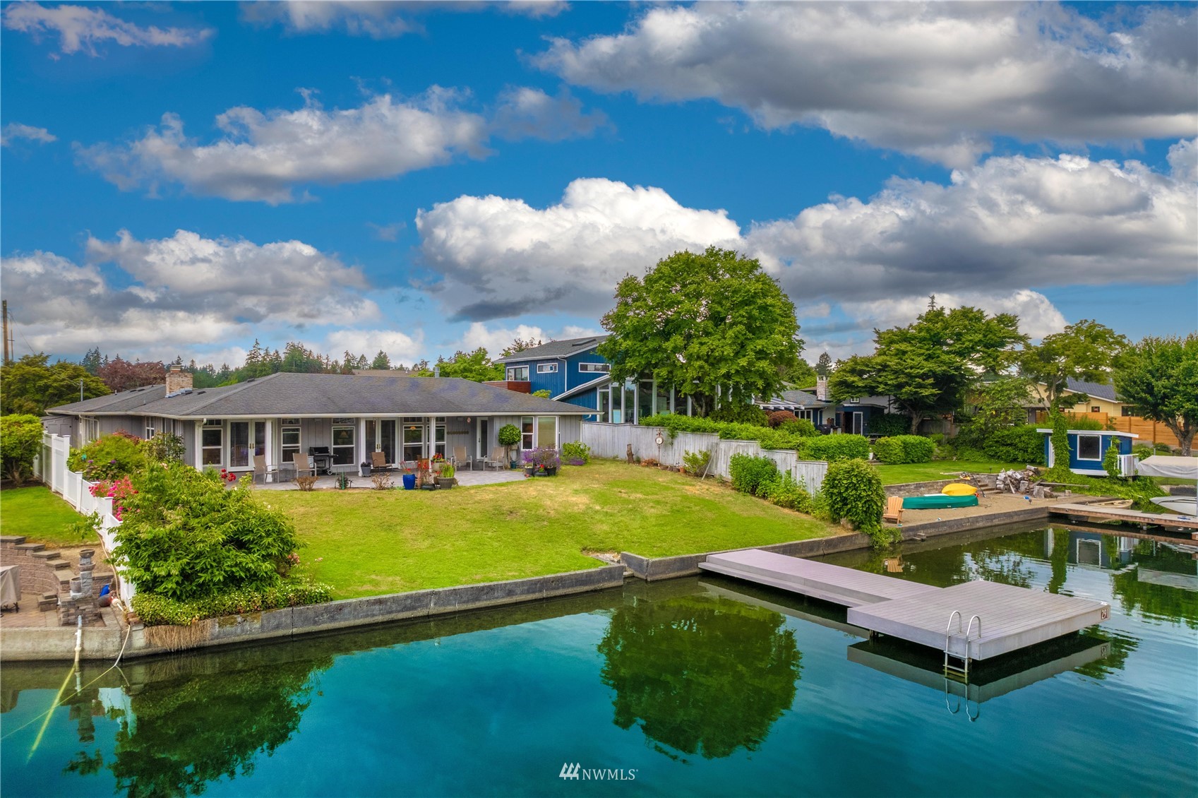 9215 Lake Steilacoom Point Road Southwest Lakewood, WA 98498 - Photo 2 of 36 an aerial view of a house with swimming pool garden and patio