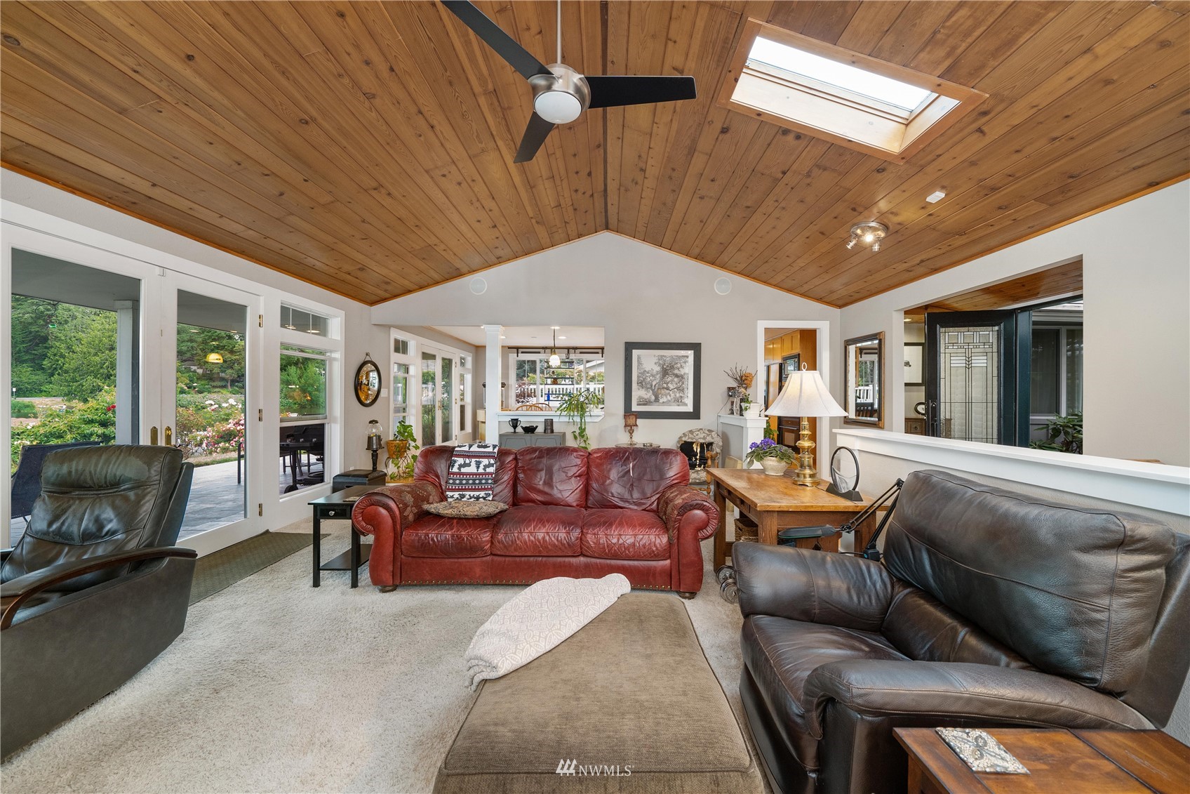 9215 Lake Steilacoom Point Road Southwest Lakewood, WA 98498 - Photo 24 of 36 a living room with furniture and a large window