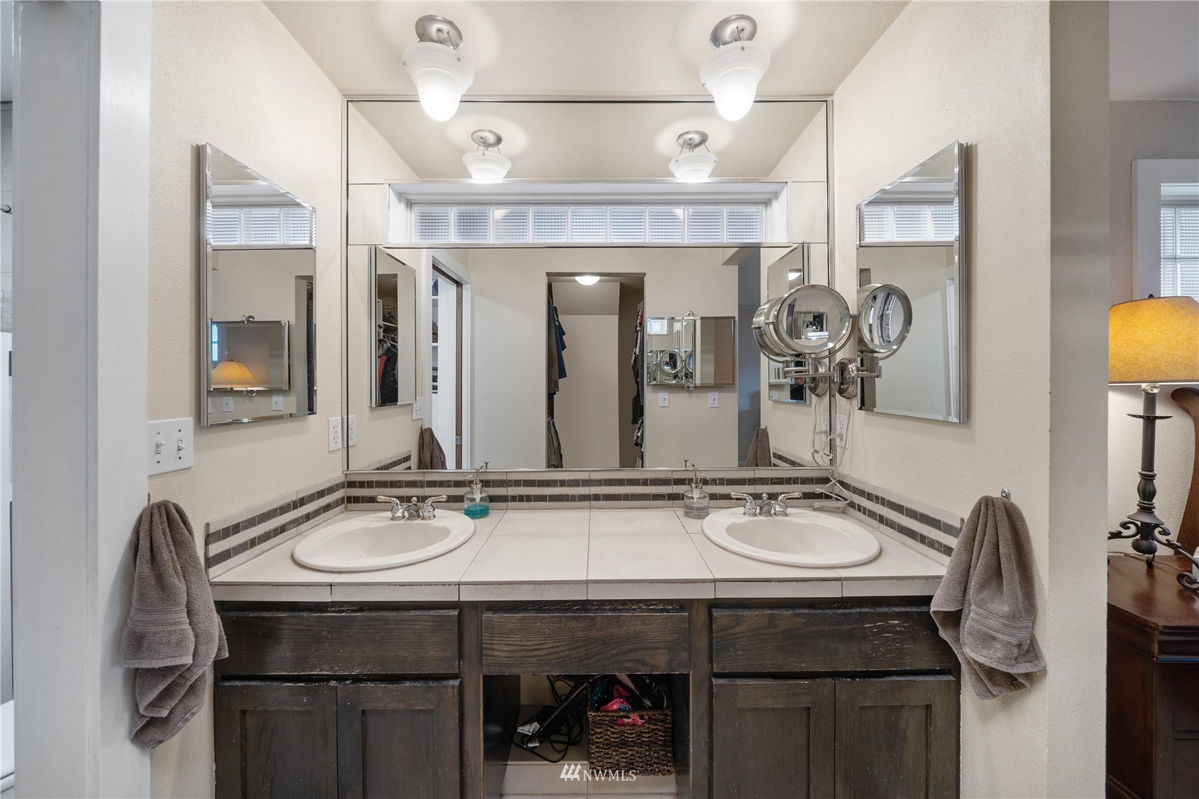 9215 Lake Steilacoom Point Road Southwest Lakewood, WA 98498 - Photo 30 of 36 a bathroom with a sink double vanity and a mirror