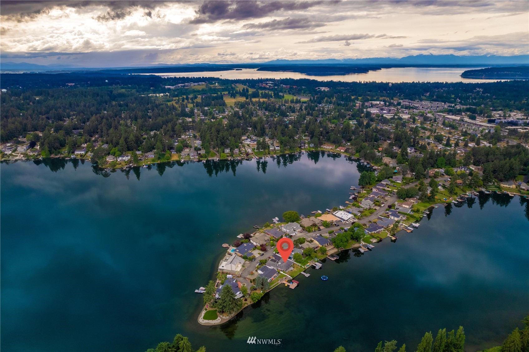 9215 Lake Steilacoom Point Road Southwest Lakewood, WA 98498 - Photo 3 of 36 a view of a lake with a mountain