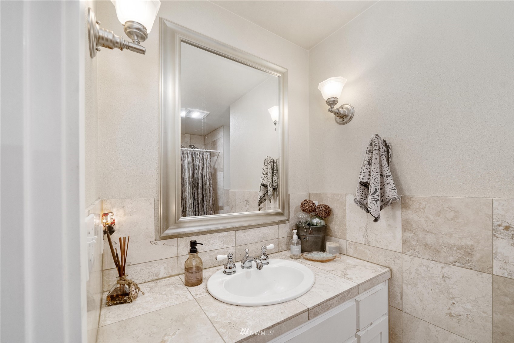 9215 Lake Steilacoom Point Road Southwest Lakewood, WA 98498 - Photo 32 of 36 a bathroom with a sink and a mirror