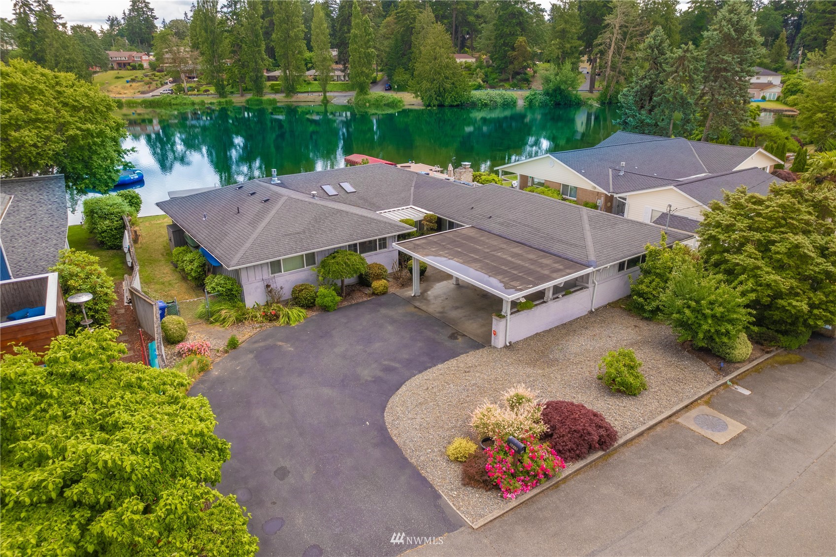 9215 Lake Steilacoom Point Road Southwest Lakewood, WA 98498 - Photo 5 of 36 an aerial view of a house with garden space and a patio