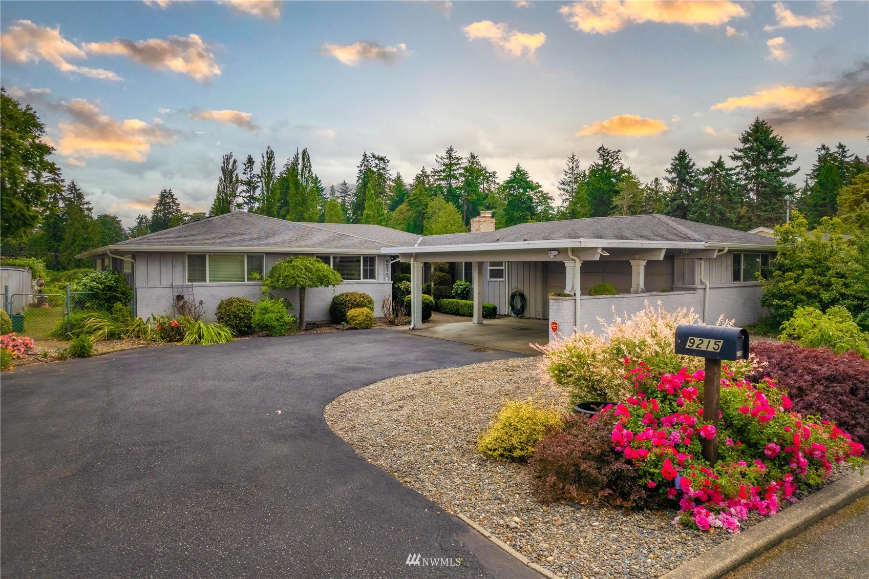 9215 Lake Steilacoom Point Road Southwest Lakewood, WA 98498 - Photo 6 of 36 front view of a house with a yard