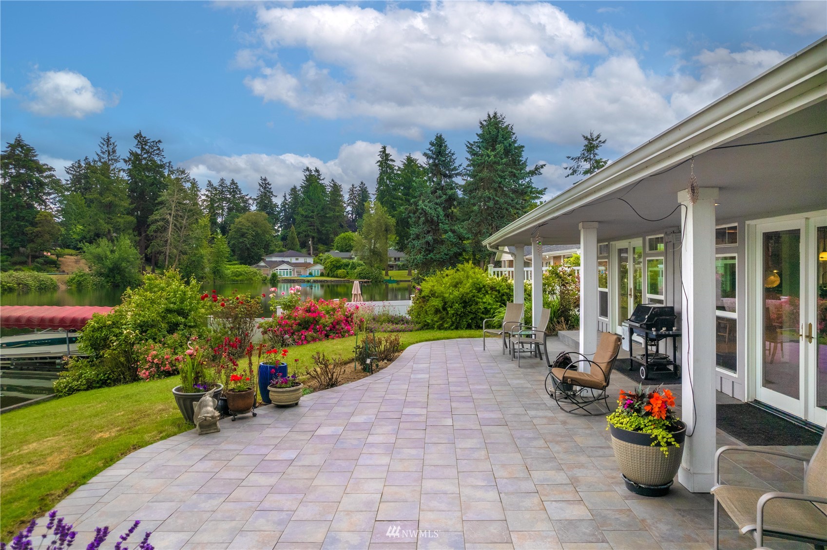 9215 Lake Steilacoom Point Road Southwest Lakewood, WA 98498 - Photo 10 of 36 a view of a chair and tables in the patio in front of a house