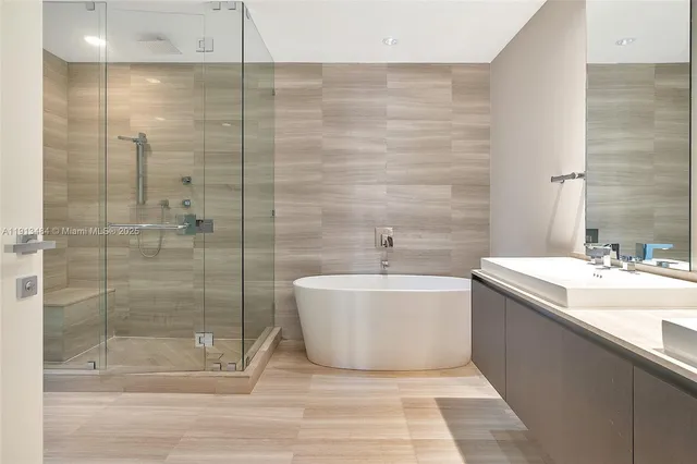a bathroom with a bathtub and sink