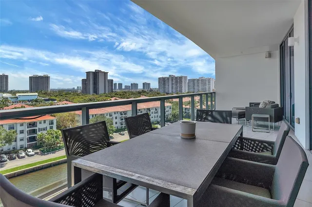 a view of a balcony with furniture