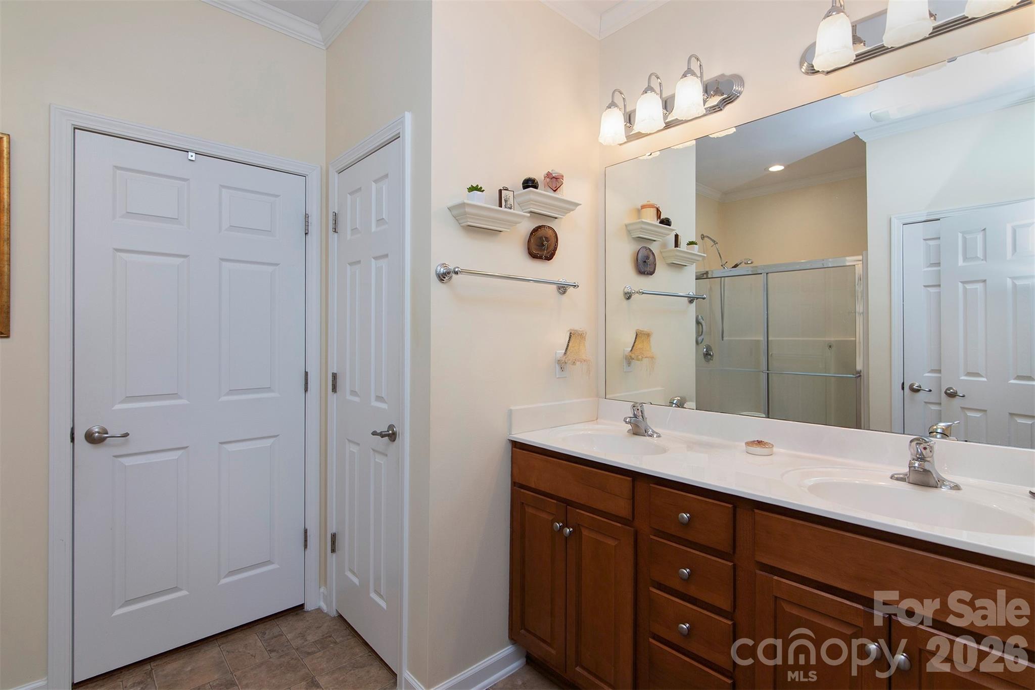 215 Garnet Court Fort Mill, SC 29708 - Photo 11 of 16 a bathroom with a double vanity sink mirror and shower