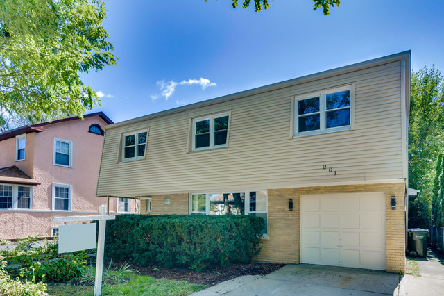 261 East Quincy Street Riverside, IL 60546 - Photo 3 of 26 a house view with a backyard space