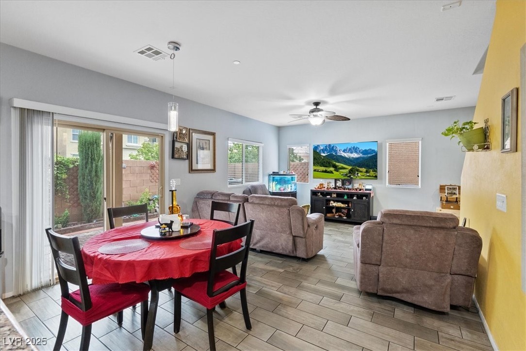 9040 Magnetic Court Las Vegas, NV 89149 - Photo 12 of 43 Dining space featuring wood finish floors and ceiling fan