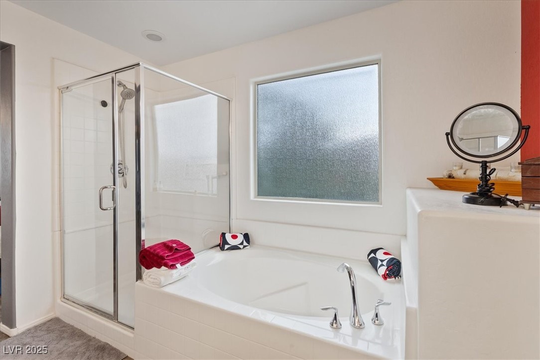 9040 Magnetic Court Las Vegas, NV 89149 - Photo 21 of 43 Full bathroom featuring a shower stall and a bath