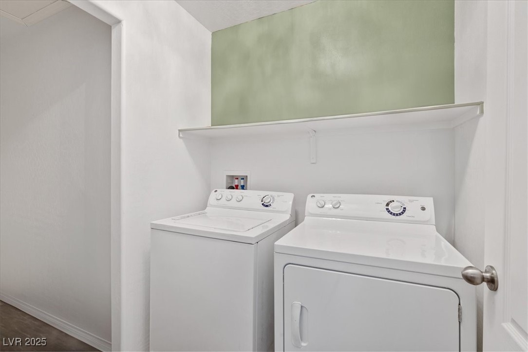 9040 Magnetic Court Las Vegas, NV 89149 - Photo 25 of 43 Laundry area with independent washer and dryer and baseboards