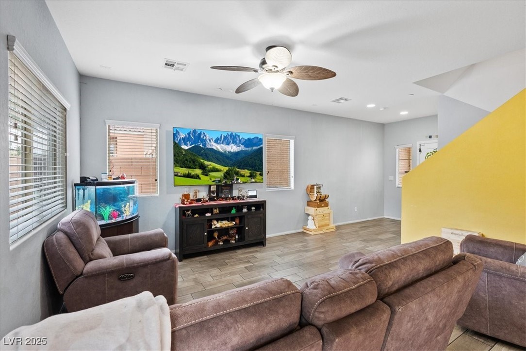 9040 Magnetic Court Las Vegas, NV 89149 - Photo 8 of 43 Living area featuring a ceiling fan and baseboards