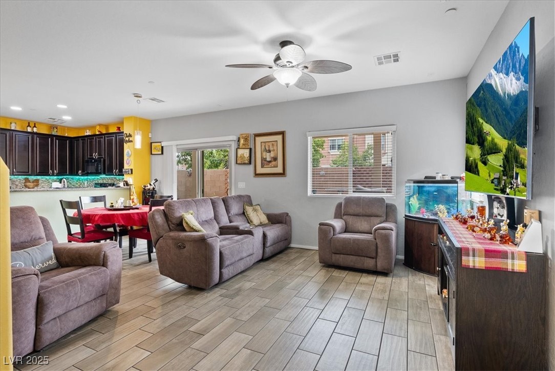 9040 Magnetic Court Las Vegas, NV 89149 - Photo 9 of 43 Living room with wood tiled floors, ceiling fan, and recessed lighting