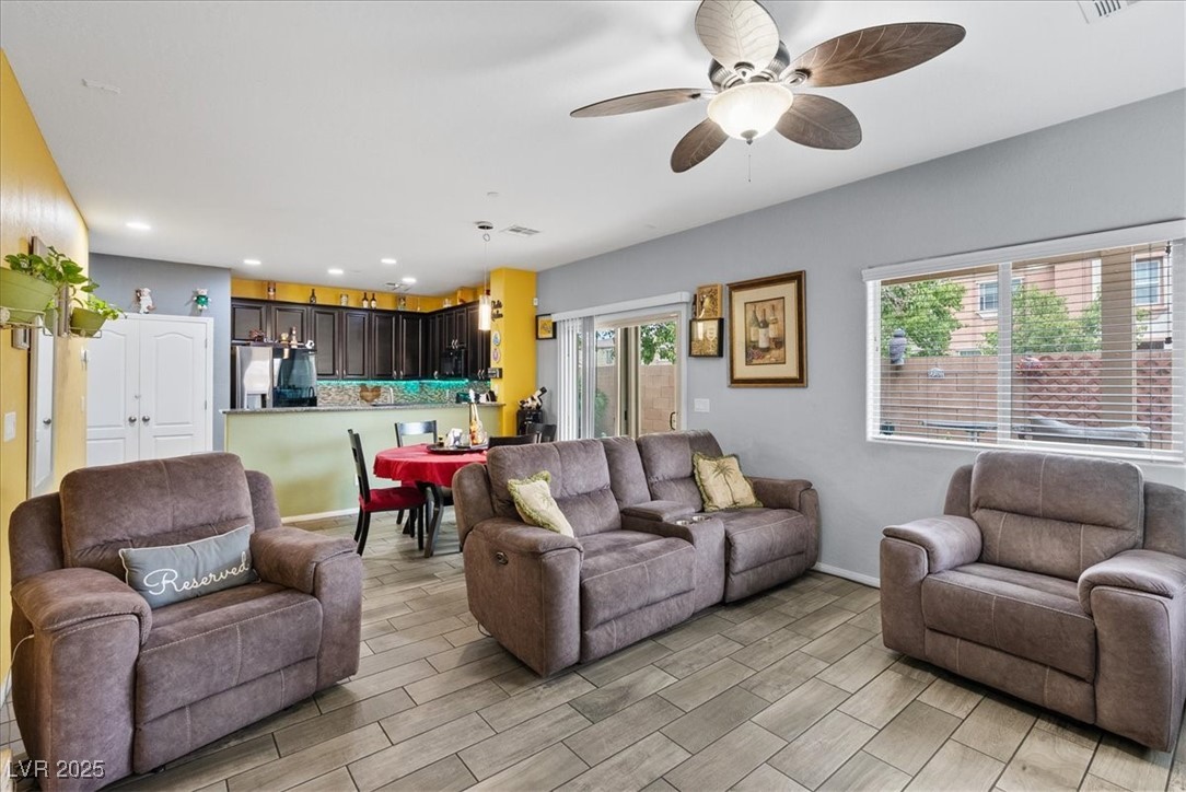 9040 Magnetic Court Las Vegas, NV 89149 - Photo 10 of 43 Living room with wood tiled floors, recessed lighting, and a ceiling fan