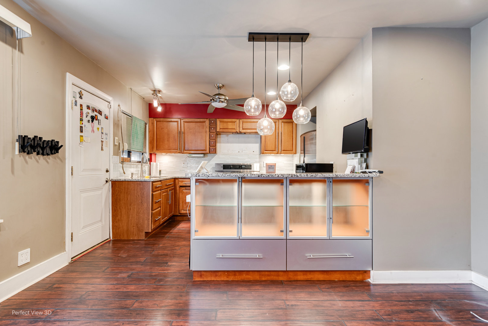 6726 South Merrill Avenue Chicago, IL 60649 - Photo 9 of 22 a view of cabinets and kitchen with stainless steel appliances