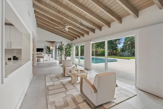 a large kitchen with a table and chairs