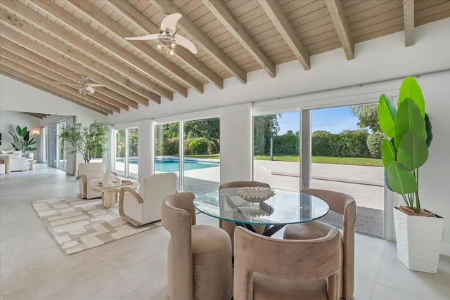 a kitchen with stainless steel appliances kitchen island granite countertop a sink and cabinets