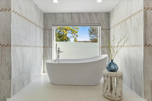 a bathroom with a sink vanity and a mirror