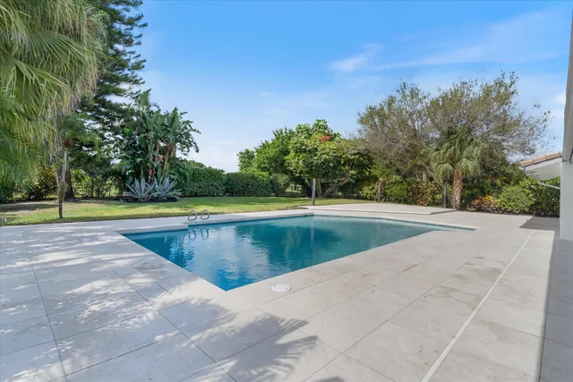 an aerial view of a house with a garden and outdoor view