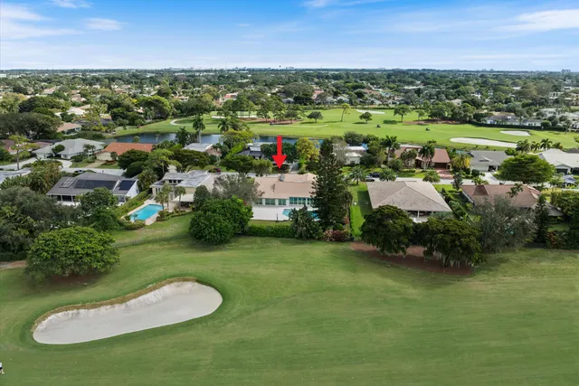 a view of a swimming pool with a garden