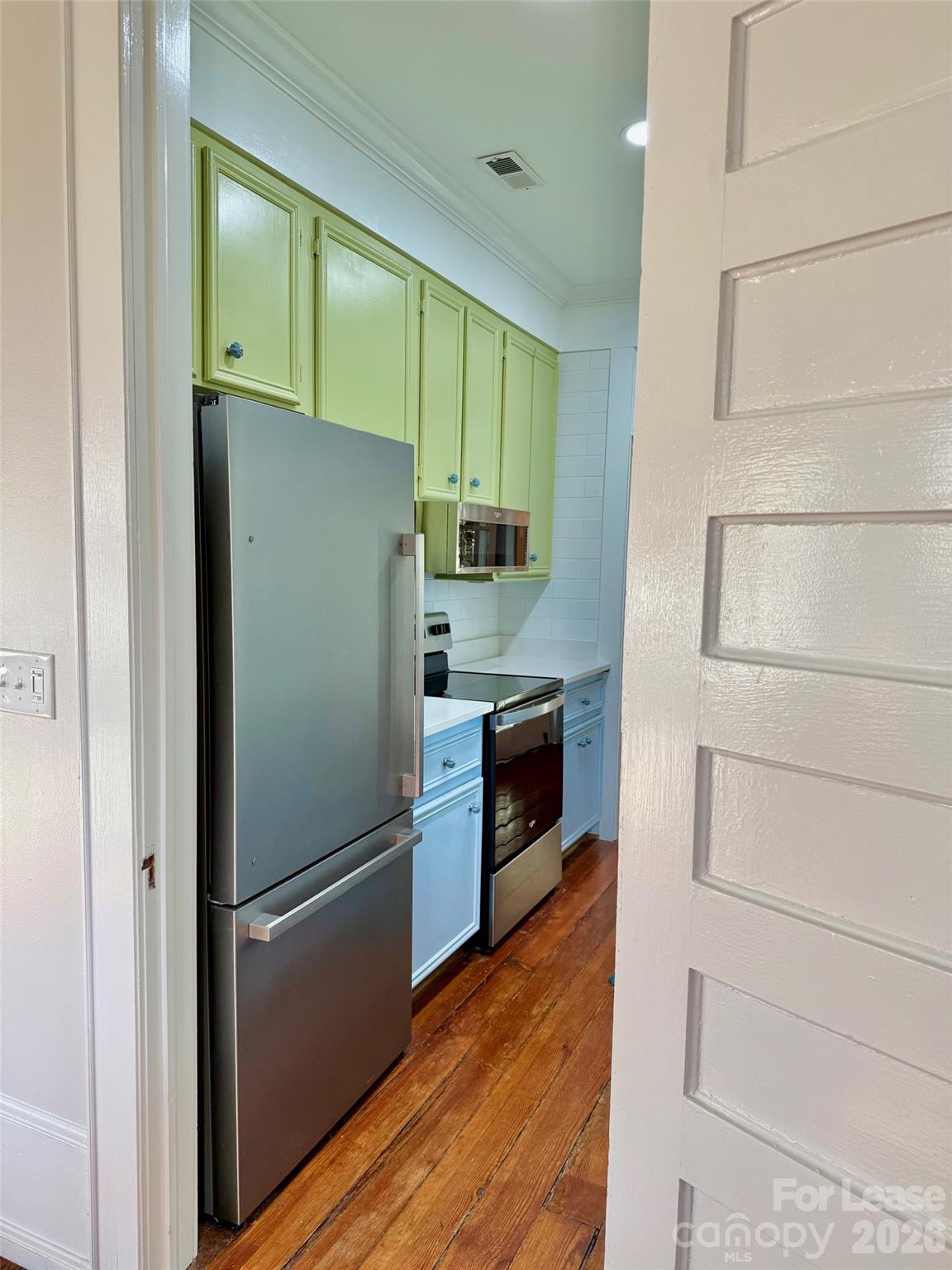 22 South Congress Street, Unit A York, SC 29745 - Photo 13 of 23 a kitchen with a refrigerator and a stove