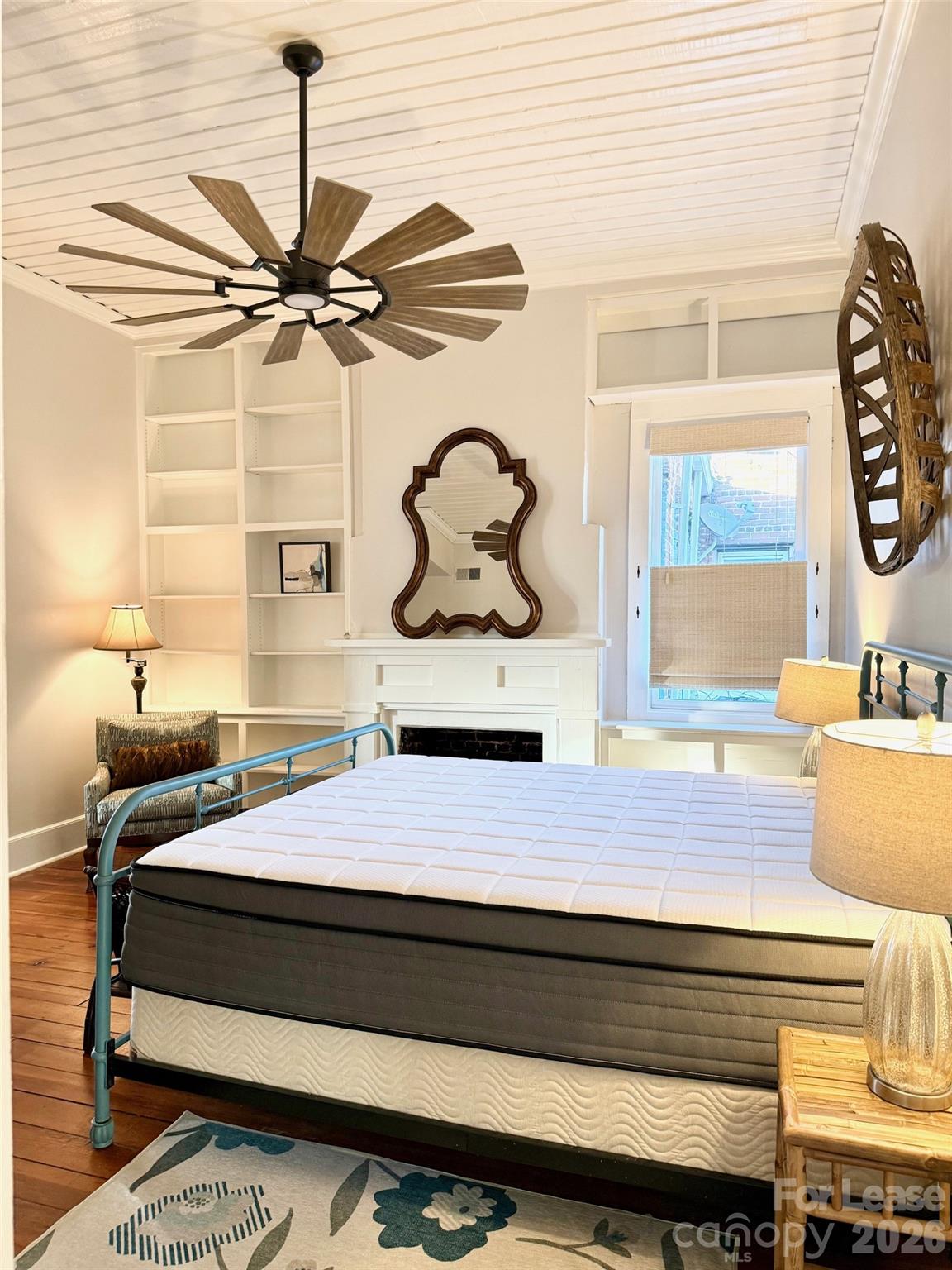 22 South Congress Street, Unit A York, SC 29745 - Photo 21 of 23 a bedroom with a bed and a painting on the wall
