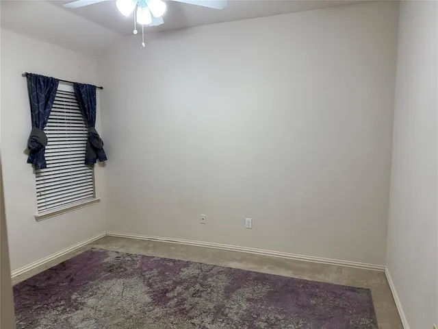 en empty room with windows